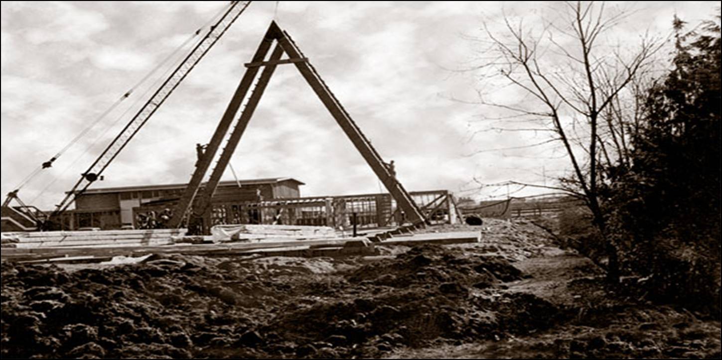 Historic black and white 1964 photograph showing the construction of Trinity Lutheran Church in Richmond, BC, with a crane raising the distinctive A-frame structural beams.
